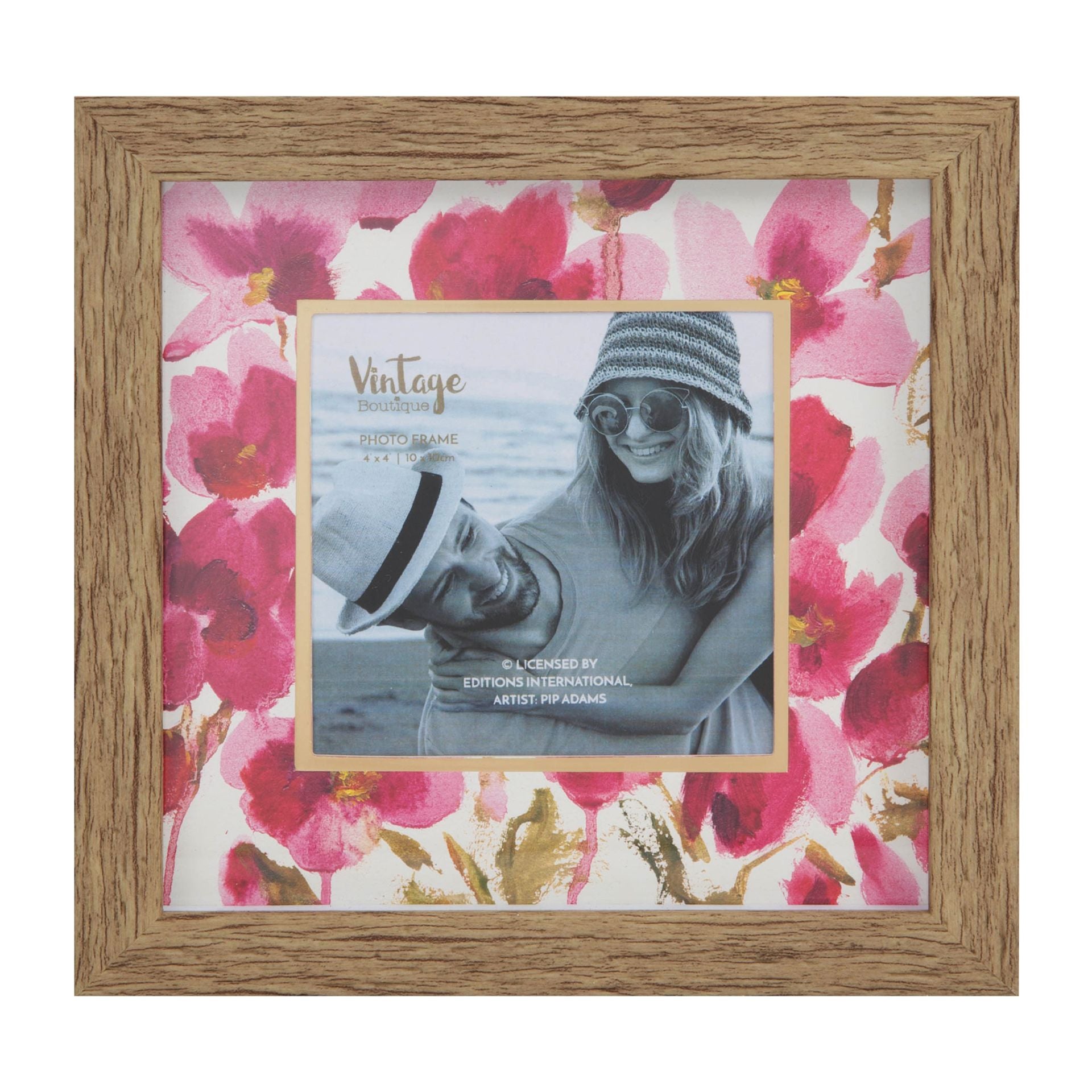 Wooden photo frame with floral design and a smaller photo of a person wearing sunglasses and a hat.