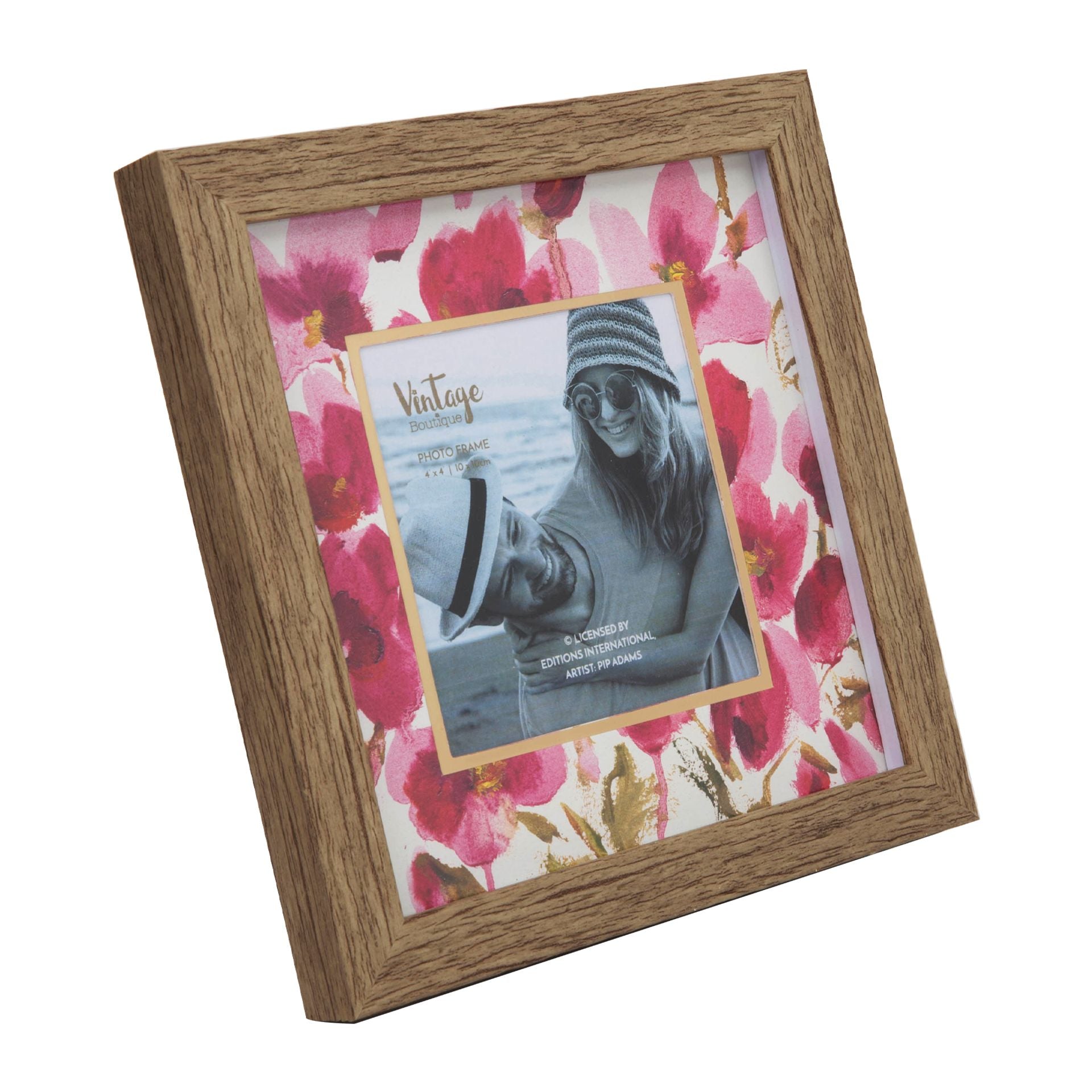 Wooden photo frame with floral design and a smaller photo of a person wearing sunglasses.