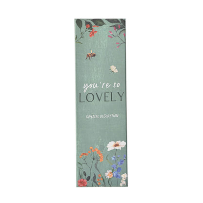 Decorative card with floral design and text on a white background