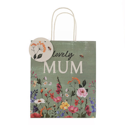 Gift bag with floral design and 'lovely MUM' text on a white background