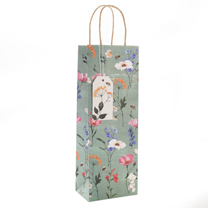 Floral-patterned bottle bag with a tag on a white background