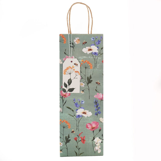 Floral-patterned bottle bag with a tag on a white background