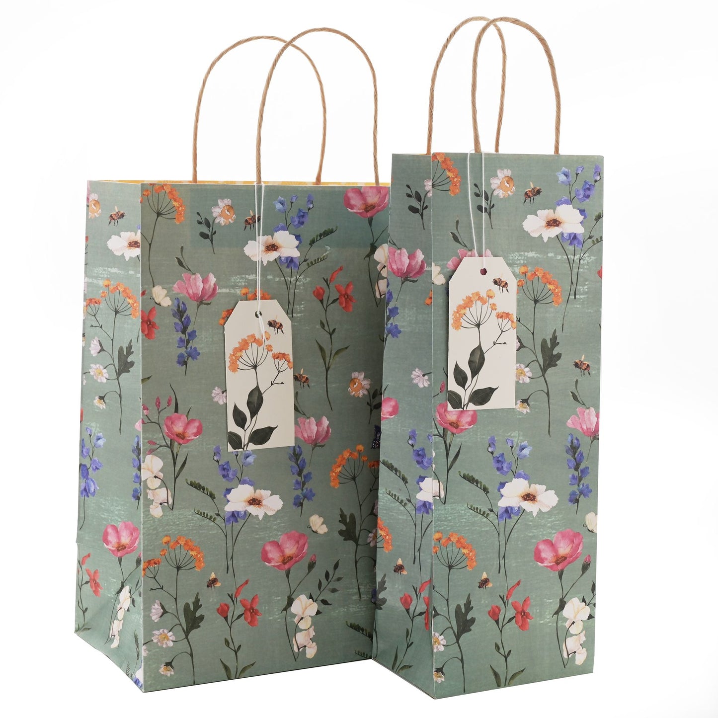 Floral-patterned bottle bags with a tag on a white background