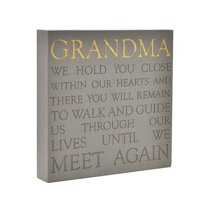 Decorative wall art with text about Grandma on a gray background