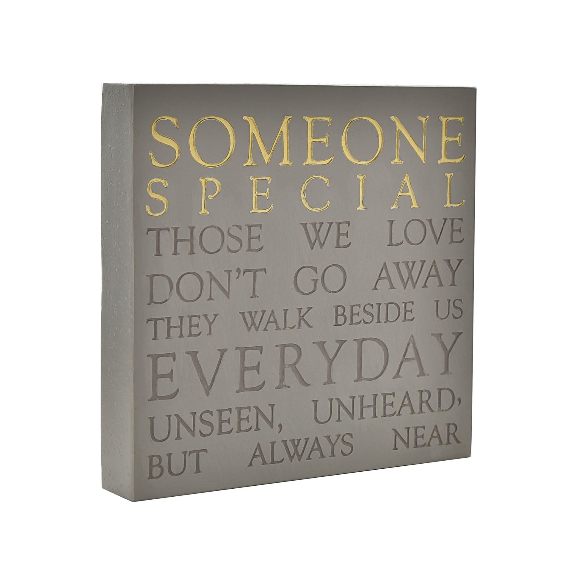 Decorative wall plaque with inspirational quote on a gray background