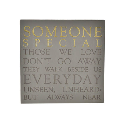 Decorative wall art with inspirational quote on a gray background