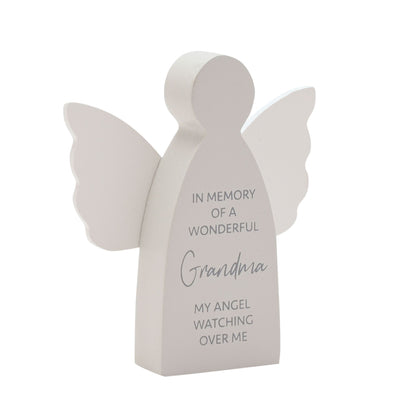 Memorial angel figurine with engraved text on a white background
