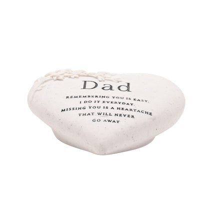 Heart-shaped stone with a message for Dad on a white background