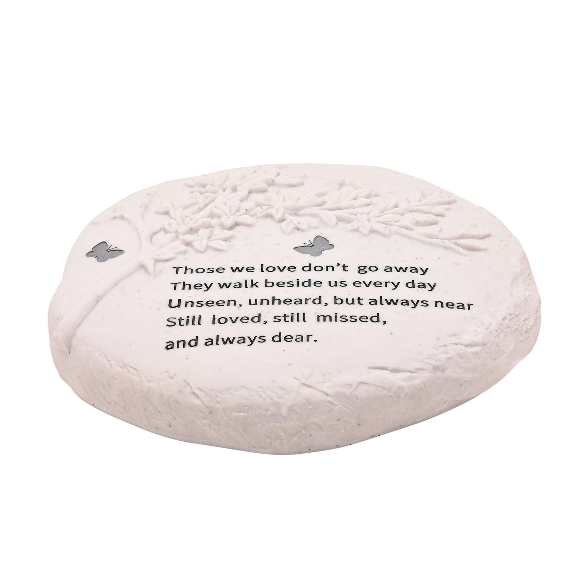 Decorative stone with engraved text and butterfly designs on a white background