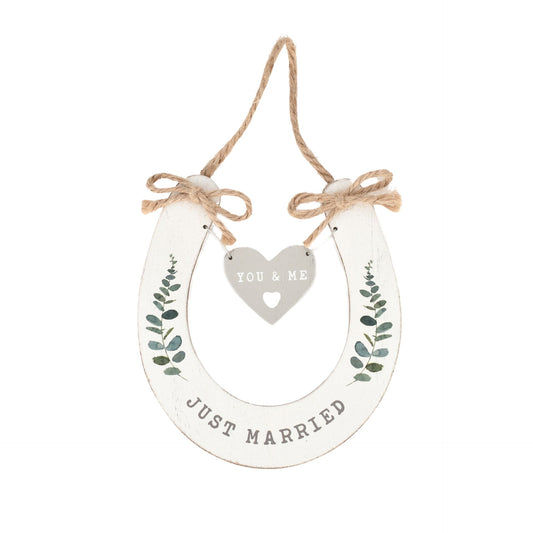 Decorative hanging sign with 'Just Married' and 'You & Me' text on a white background
