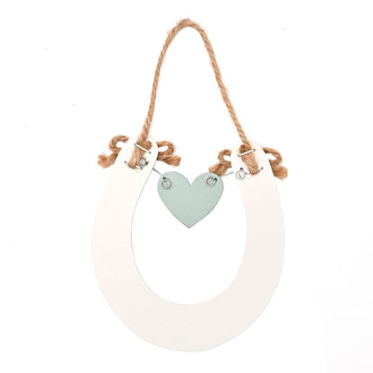 Decorative hanging sign with a heart-shaped tag on a white background