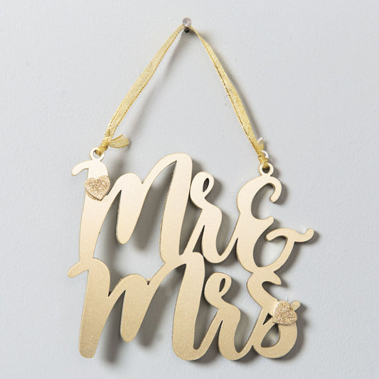 Decorative sign with 'Mr & Mrs' on a light gray background