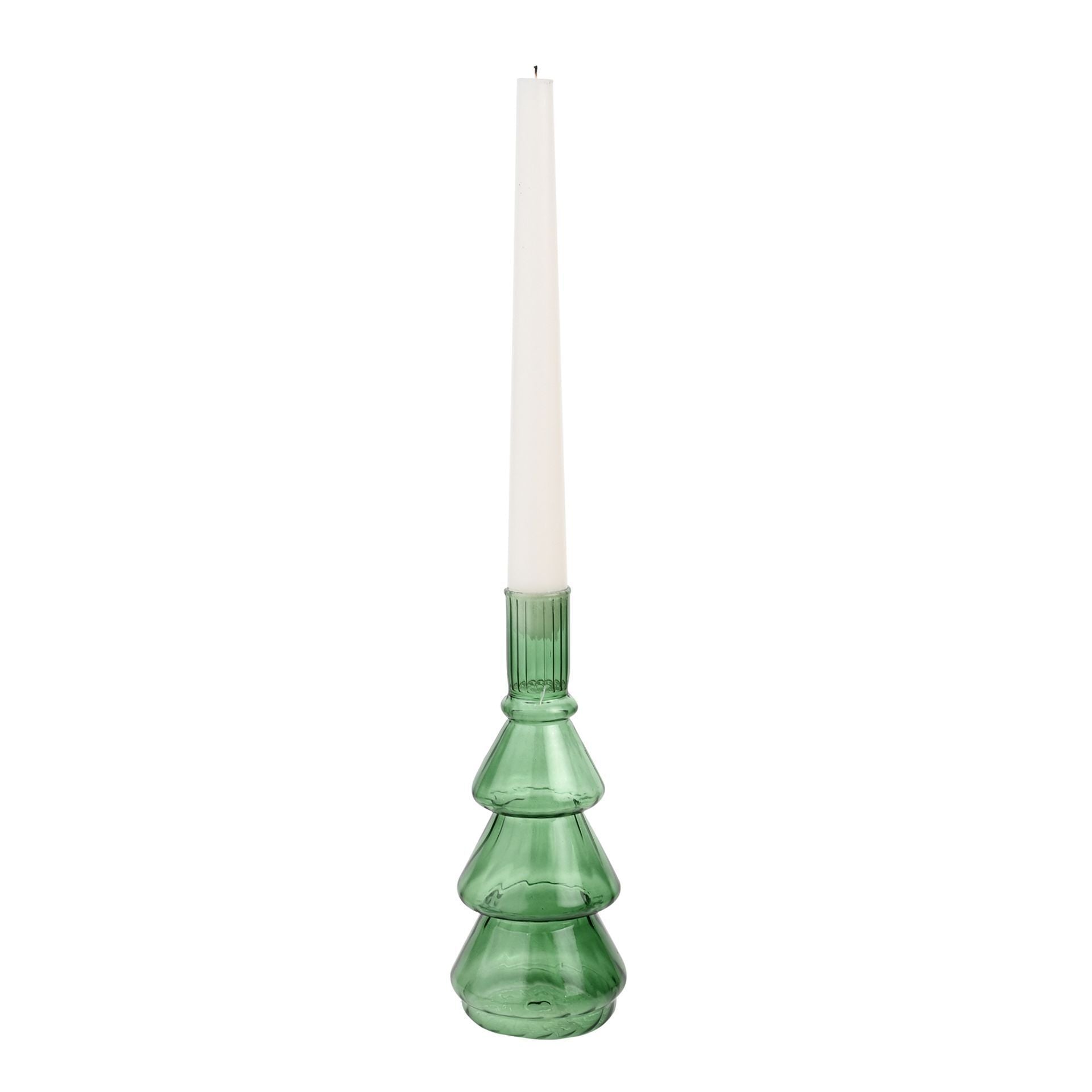 Green glass candle holder with a white candle on a white background