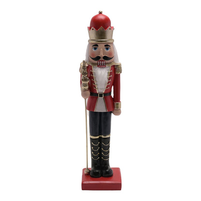 Nutcracker figurine with red hat and uniform on a white background