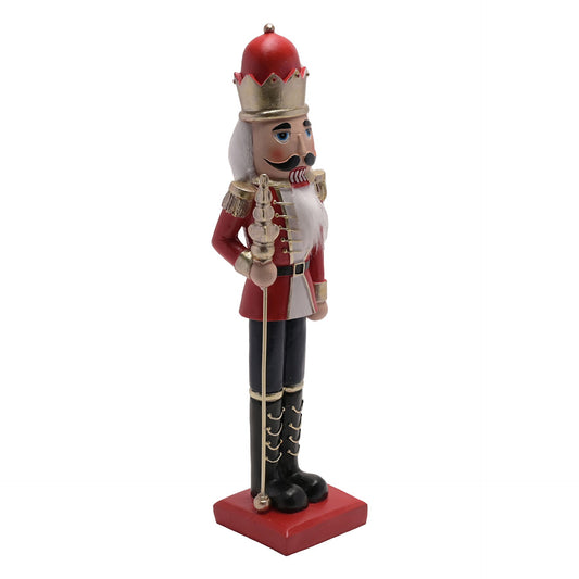 Nutcracker figurine with red hat and uniform on a white background