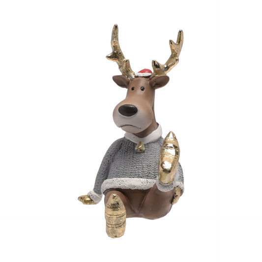 Decorative reindeer figurine wearing a sweater and Santa hat on a white background