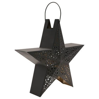 Black star-shaped lantern with cut-out patterns on a white background