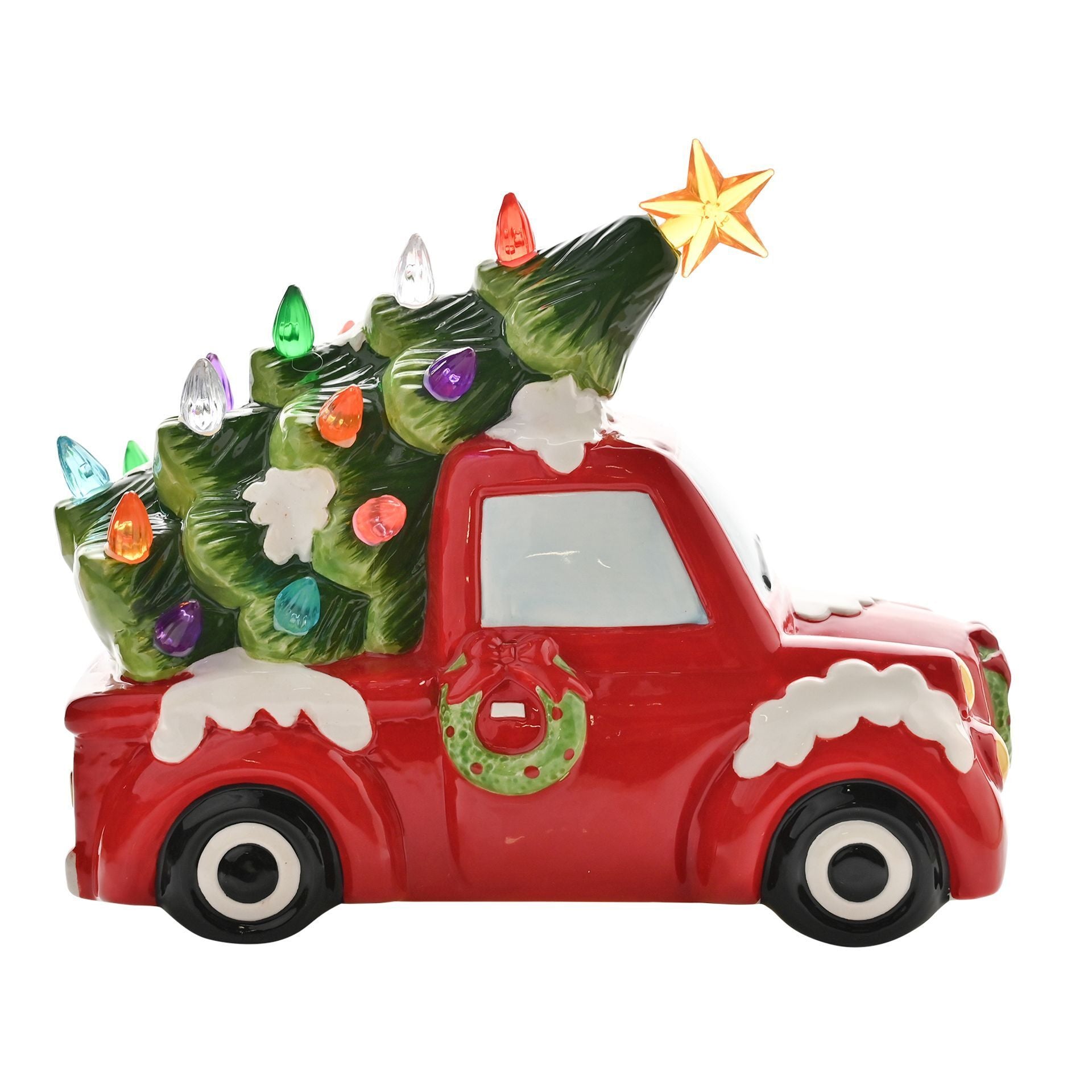 Decorative Christmas ornament of a red truck with a tree on a white background