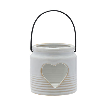White ceramic jar with heart-shaped cutout and black handle on a white background
