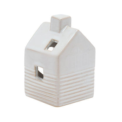White ceramic house-shaped object on a white background