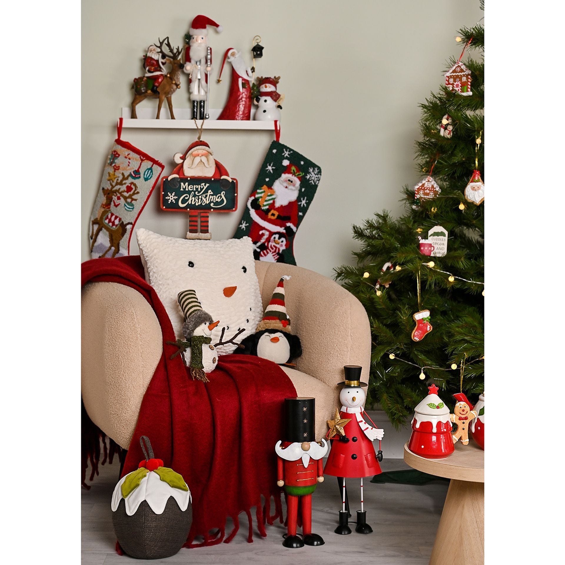 Christmas-themed room with stockings, tree, and decorative items.