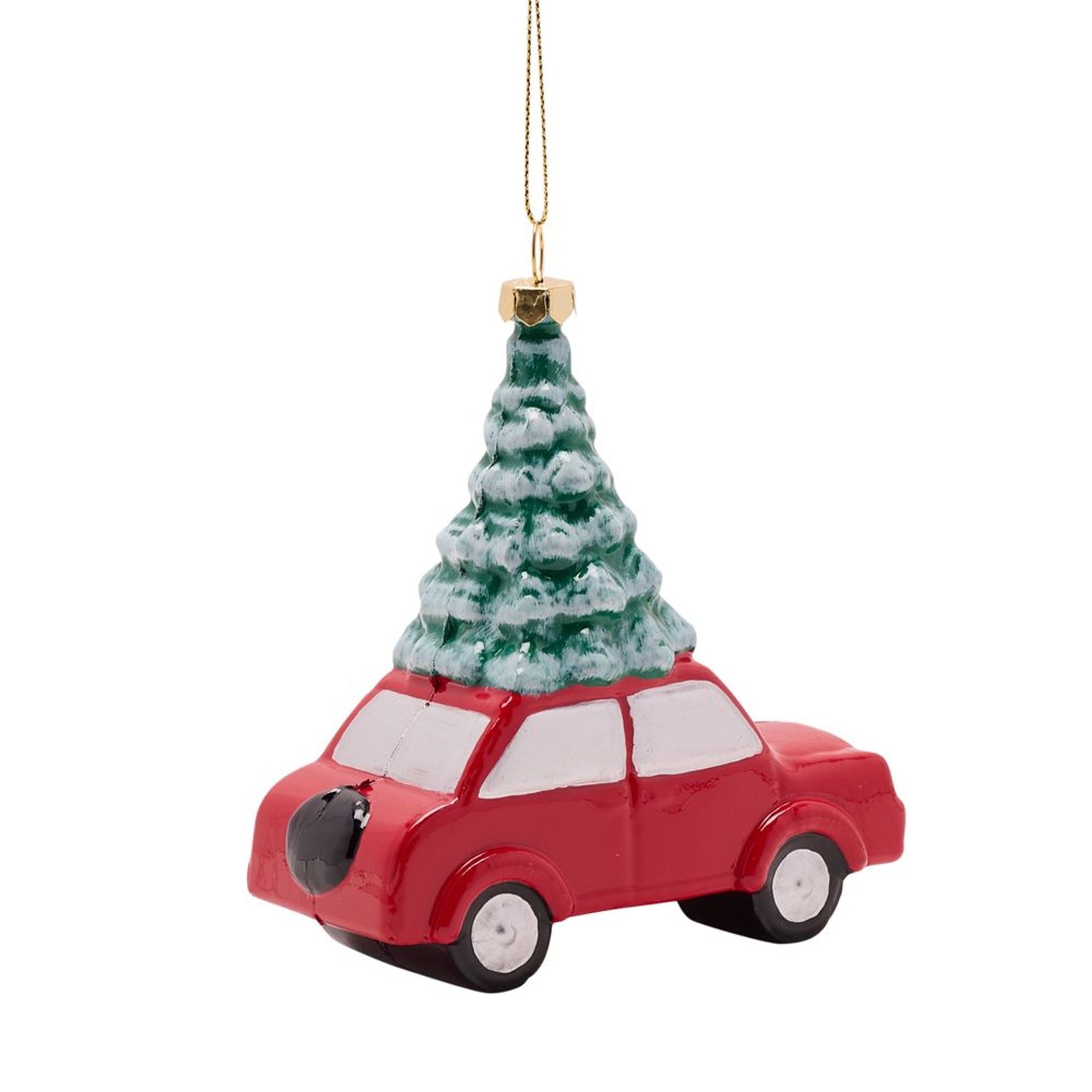 Red car ornament with a Christmas tree on top against a white background