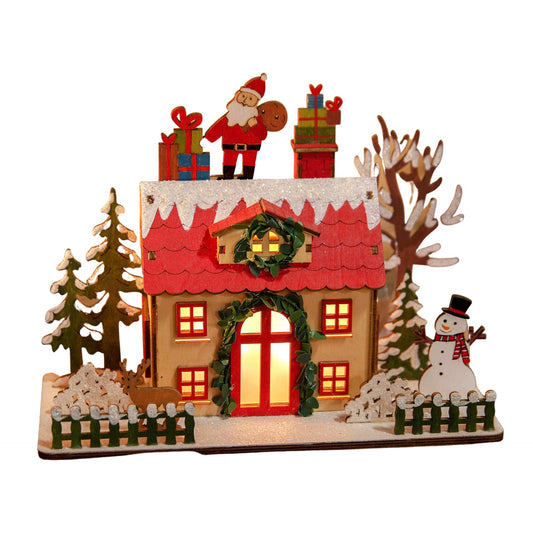 Decorative Christmas scene with a house, Santa Claus, and snowman on a white background