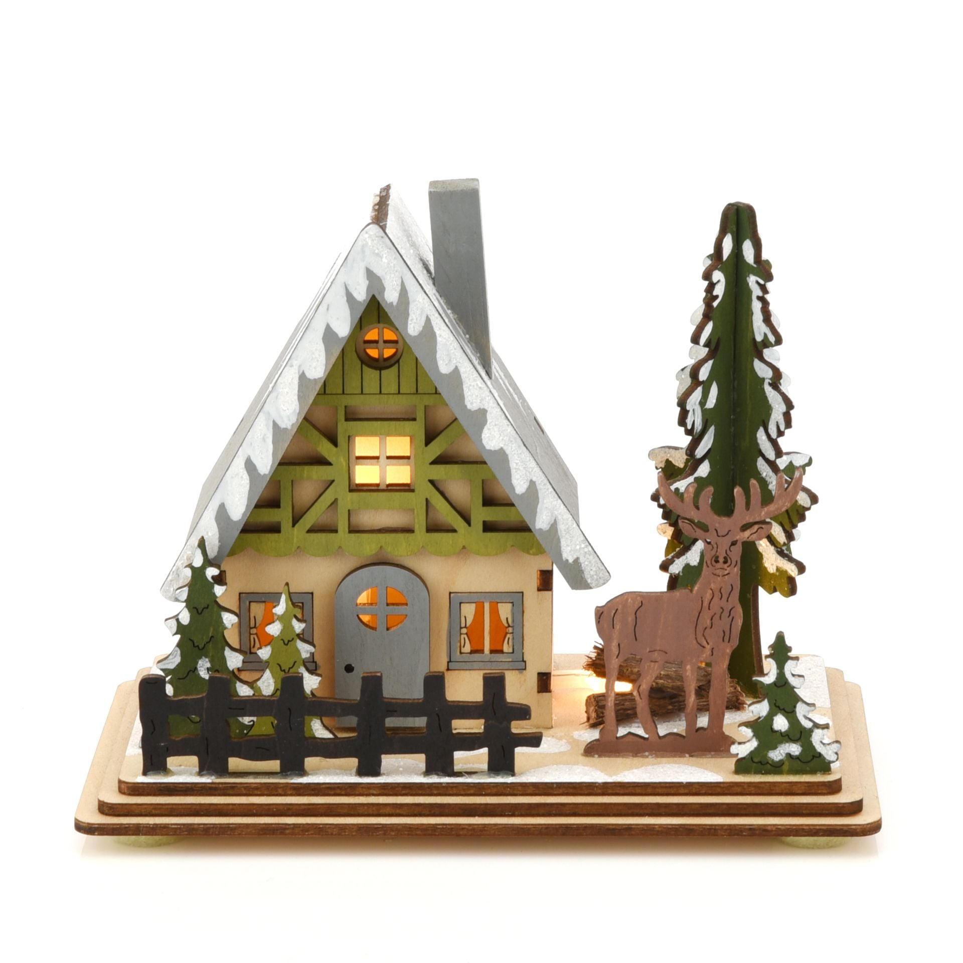 Wooden cabin model with a deer and trees on a white background