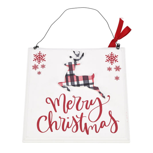 White plaque that says "Merry Christmas"