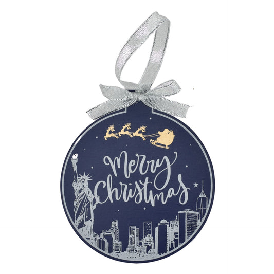 Decorative Christmas ornament with 'Merry Christmas' text, Statue of Liberty, and city skyline on a blue background.